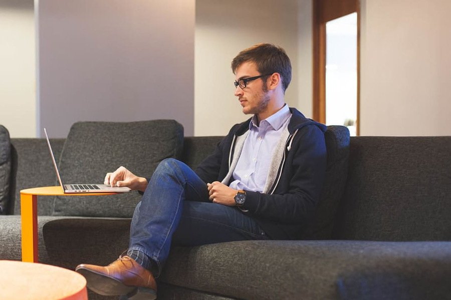 Young man relaxed using laptop